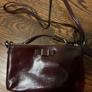 Coach wine coloured bow crossbody like new condition.